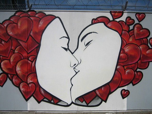 graffiti art sharing a kiss
