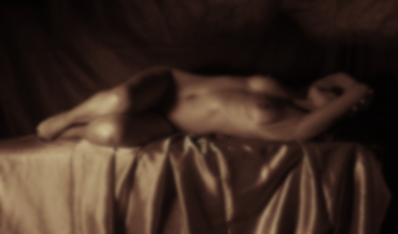 nude woman, lying on bed, waiting for sexual release