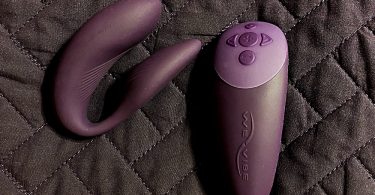 purple we-vibe chorus and remote control sitting on bedspread background - a review for the we-vibe chorus